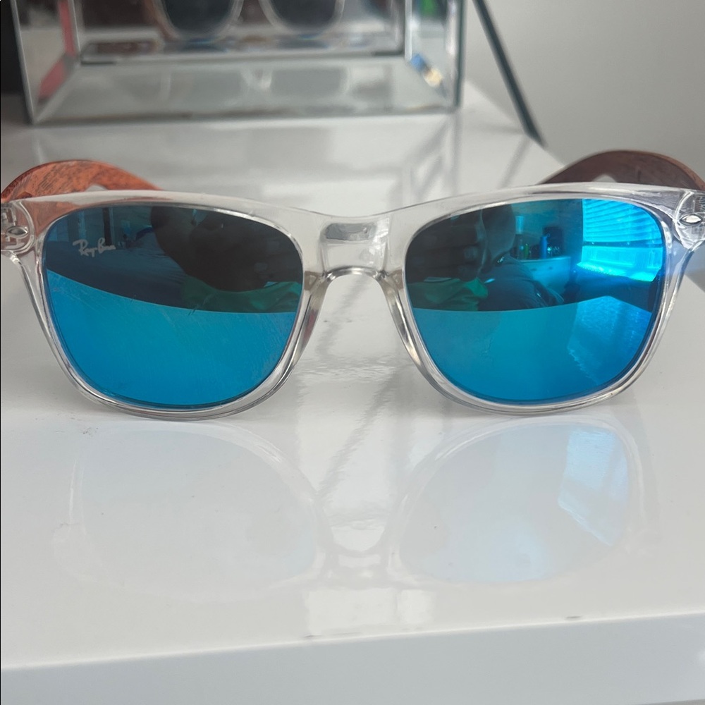 Ray-Ban Transparent Frame Sunglasses with Blue Lenses